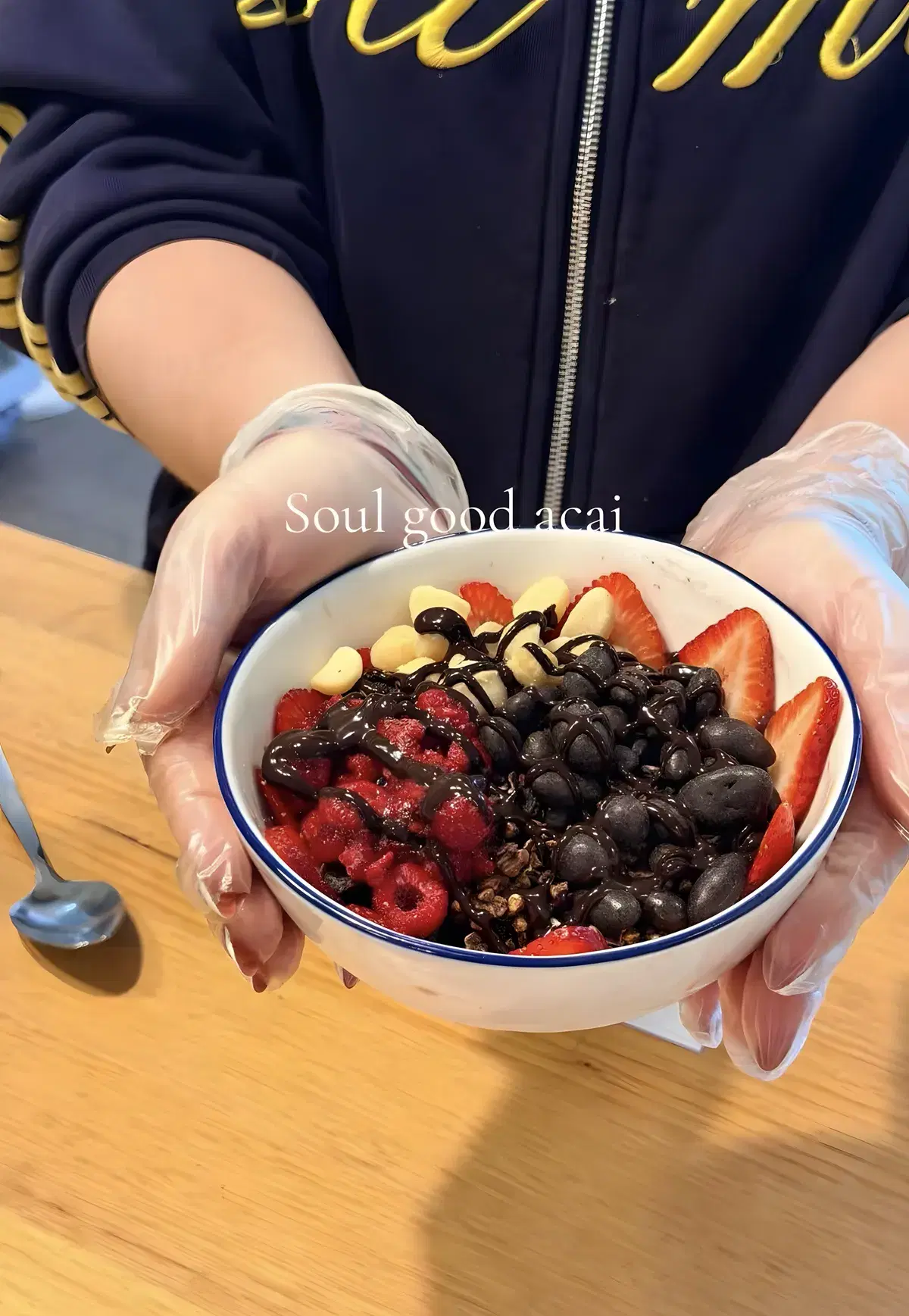 Soul Good acai bowl with strawberries, raspberries, banana and a chocolate drizzle