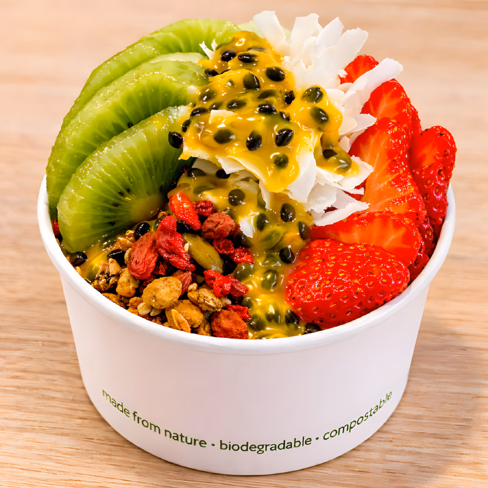 Eye Opener Acai Bowl topped with kiwi, strawberries, passionfruit and coconut